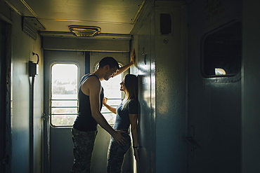 Young couple flirting in train