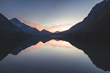 Austria, Plansee, Lake Heiterwanger in Austrian Alps in sunrise