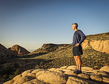 USA, Utah, St. George, Man standing in rocky landscape