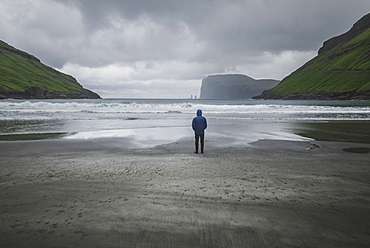 Denmark, Man standing on beach in foggy day