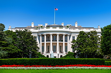 USA, Washington D.C., White house with green grass and summer sky