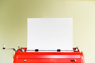 Typewriter with blank sheet of paper