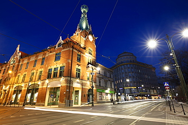 Poland, Lesser Poland, Krakow, Illuminated street and buildings in historic city district