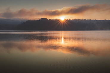 Poland, Lesser Poland, Czorsztyn, Old castle ruins by Czorsztyn Lake in Pieniny National Park at sunset