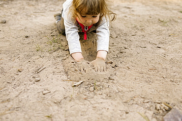 Girl (2-3) playing in sand, Wasatch Cache National Forest