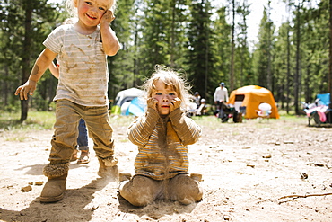 Girls (2-3) playing in sand on camping, Wasatch-Cache National Forest