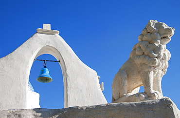 Greece, Cyclades Islands, Mykonos, Chora, Bell tower and lion statue of Paraportiani Orthodox Church