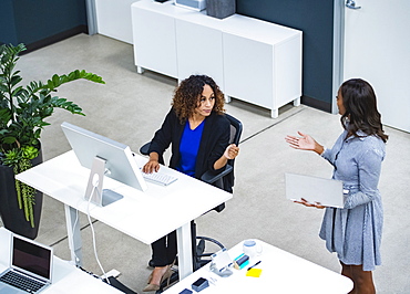 Two women working in office