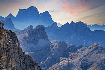 Italy, Veneto, Cortina D'Ampezzo, Dolomites, Rocky mountains ridges at sunset