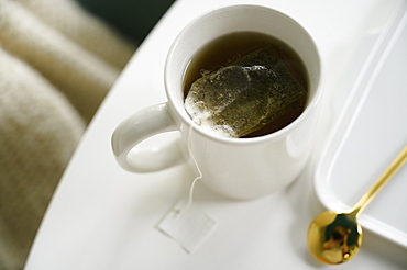 Mug with tea on table