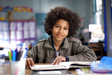 African American boy studying in classroom