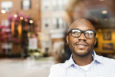 Black man looking out window