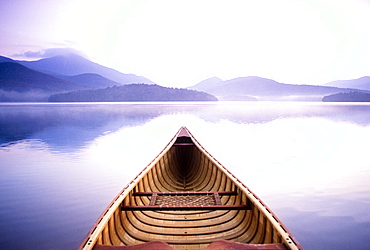 United States, New York, Lake Placid, View of Whiteface Mountain from wooden canoe on Lake Placid