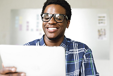 Young man using digital tablet