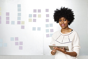 Young woman using digital tablet