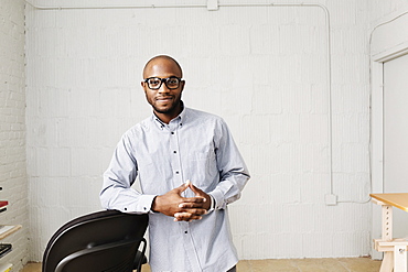 Portrait of young man in design office