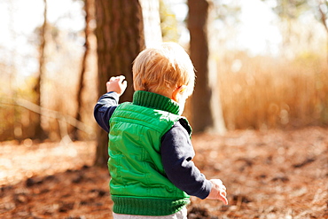 Boy walking in park