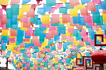 Paper flags over city street