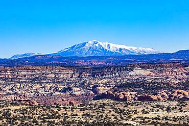 USA, Utah, Escalante, Distant snowy mountains in rocky landscape of Grand Staircase-Escalante National Monument