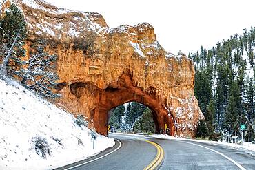 USA, Utah, Bryce Canyon, Road through sandstone arch near Bryce Canyon National Park