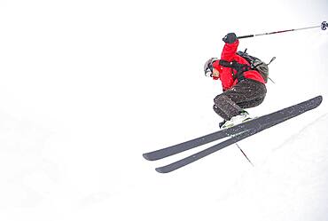 Skier jumping on snowy slope