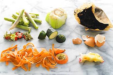 Vegetable scraps ready for compost on marble surface