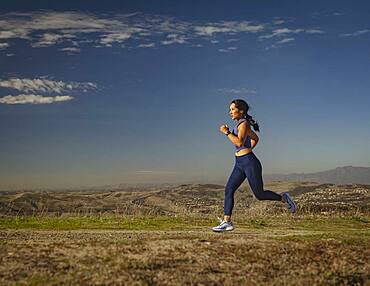 Woman jogging in landscape