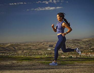 Woman jogging in landscape