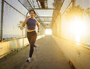 Woman jogging at sunset