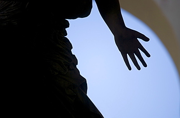 Silhouette of hand on statue Florence Italy