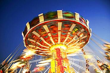 Thailand, Bangkok, Low angle view of spinning carousel