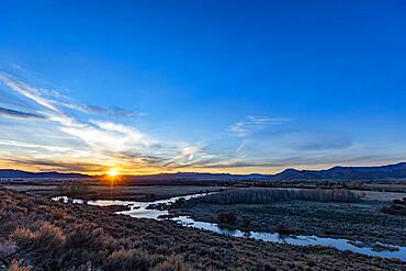 USA, Idaho, Bellevue, Sun setting behind hilly landscape near Sun Valley