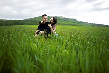 Young couple embracing in wheat field