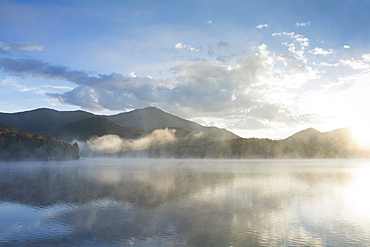 Usa, New York, Whiteface Mountain reflecting in Placid Lake