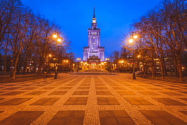 Poland, Masovia, Warsaw, Illuminated high rise building at town square