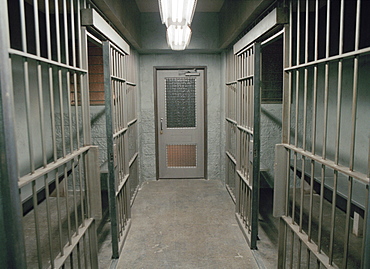 Row of empty prison cells