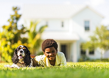 Portrait of boy (6-7) with dog, Jupiter, Florida