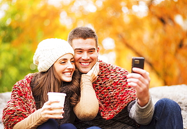 Portrait of couple in Central Park taking photo of themselves, USA, New York State, New York City