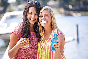 Portrait of young women posing with drinks, USA, Washington, Bellingham 