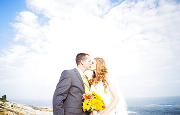 Portrait of married couple kissing, USA, Maine, Bristol 