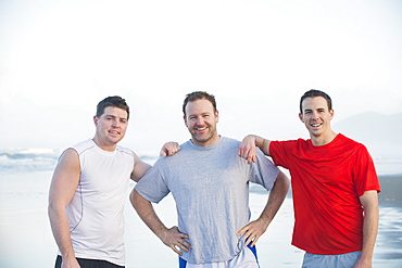 Portrait of men on beach, Rockaway Beach, Oregon