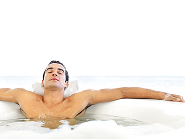 Man relaxing in bathtub