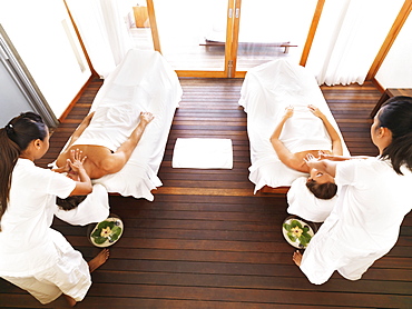 Couple getting massage in spa