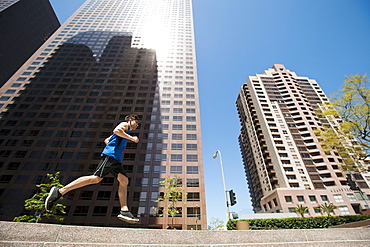 USA, California, Los Angeles, Young man running in city, USA, California, Los Angeles