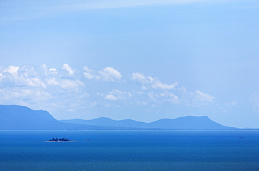 Cambodia, Kep, Blue sky over sea and mountains