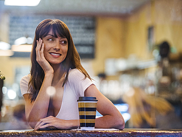 Smiling woman sitting in cafe