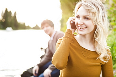 Young woman talking on phone