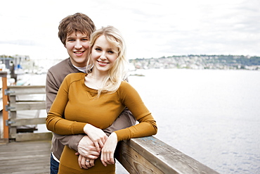 USA, Washington, Seattle, Portrait of young couple on pier