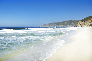 Sea waves on sandy beach