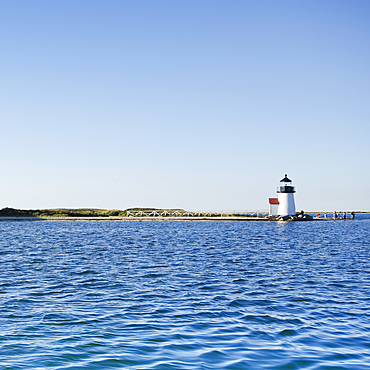 Brant Point Lighthouse and harbor with rippled water